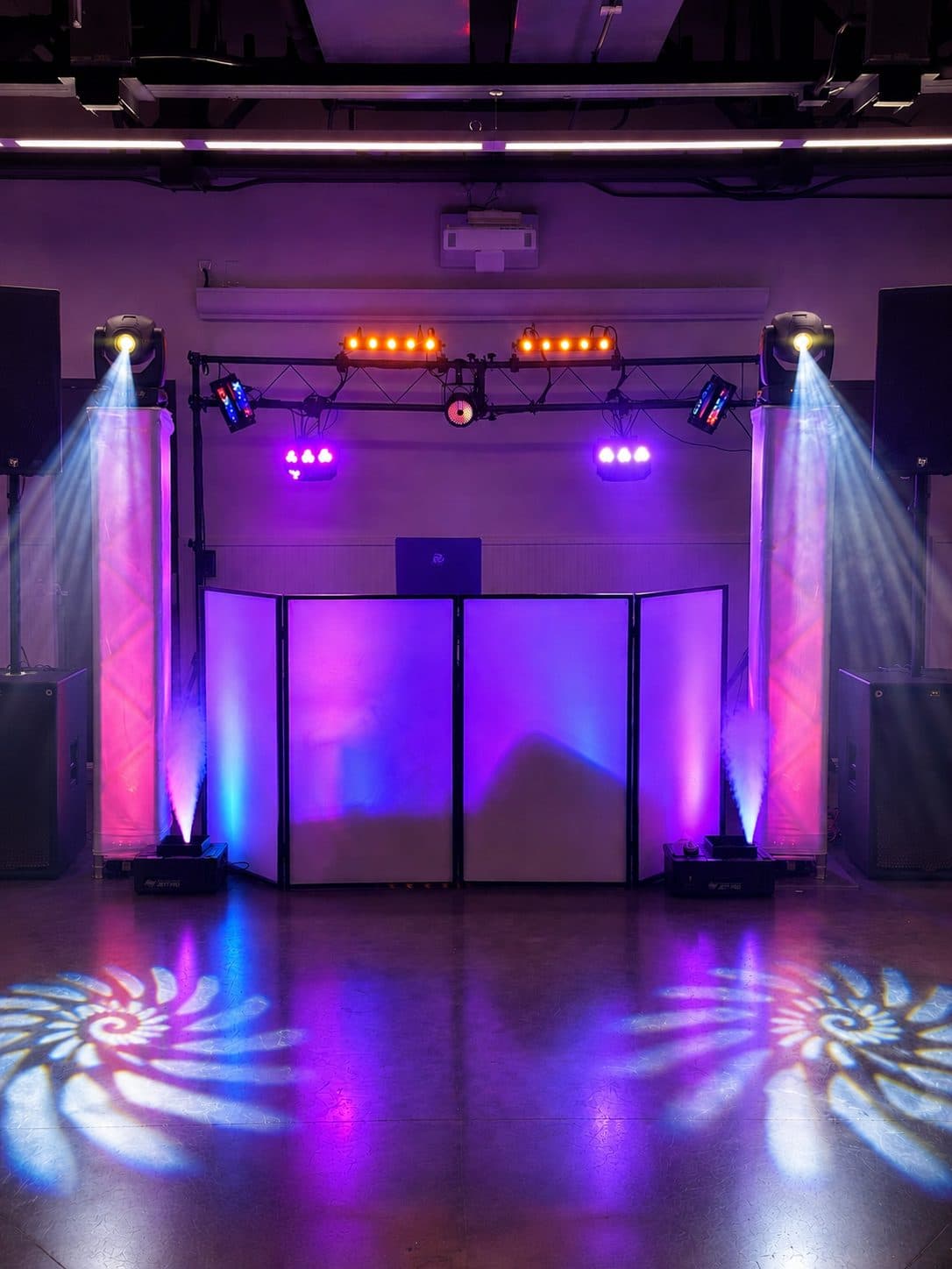 Vyoma Productions stage lighting, uplighting and gobo design filling a venue
